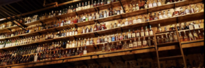 Shelf displaying alcholic beverages at a bar